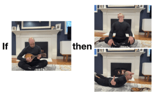 A man sitting on the ground playing guitar