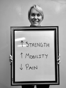 A man holding up a sign with words written on it.