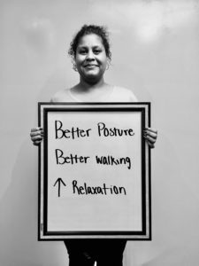 A man holding up a sign with words written on it.