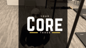 A man with sunglasses standing in front of a camera.