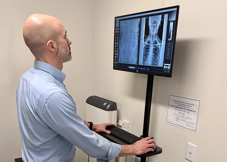 Gonstead Method - x rays - dr mirandola reviewing patient x-rays