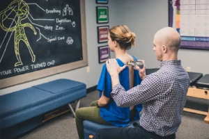 Gonstead chiropractic Dr Mirandola assessing patient spinal alignment