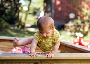 baby playing in the backyard- pediatric chiropractic care