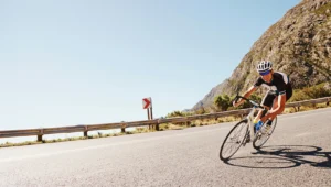 chiropractic care for athletes - cyclist riding bike down a long road