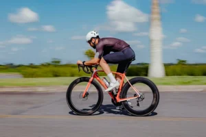 cyclist - active cyclist athlete biking down a road