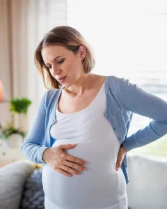 woman experiencing pregnancy discomfort - chiropractic care for pregnancy in MA