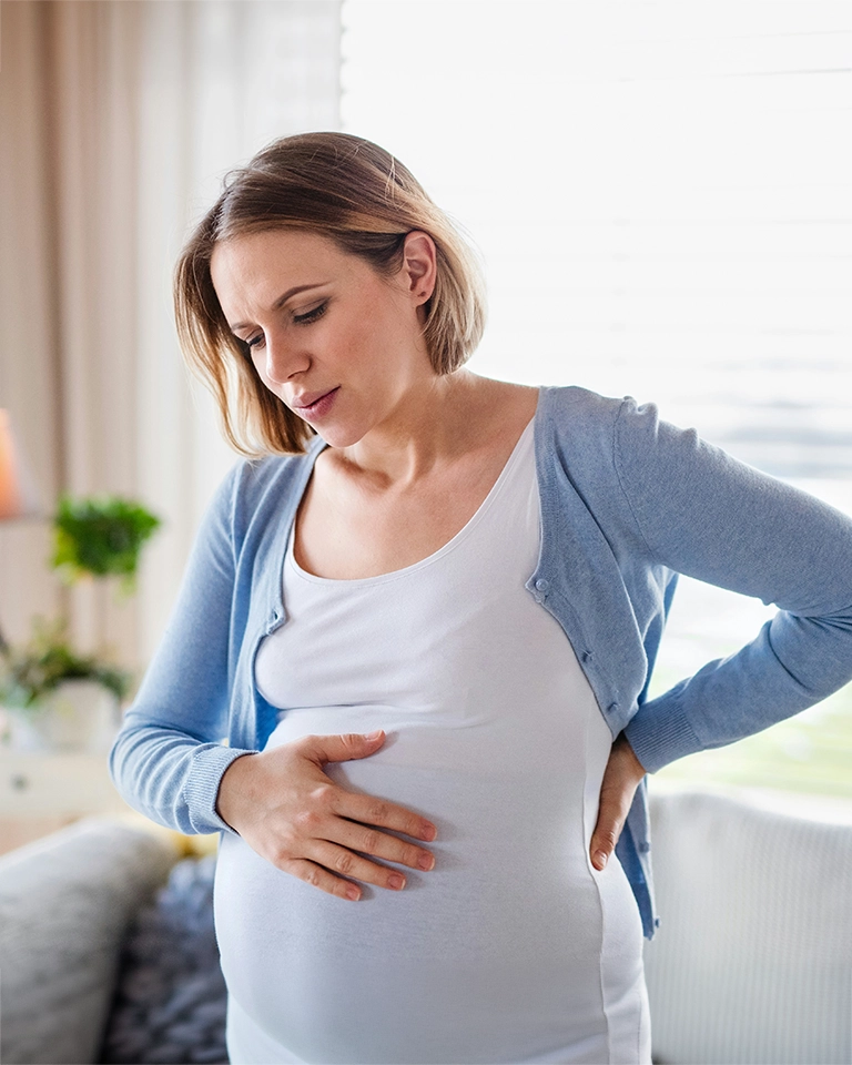 woman experiencing pregnancy discomfort - chiropractic care for pregnancy in MA